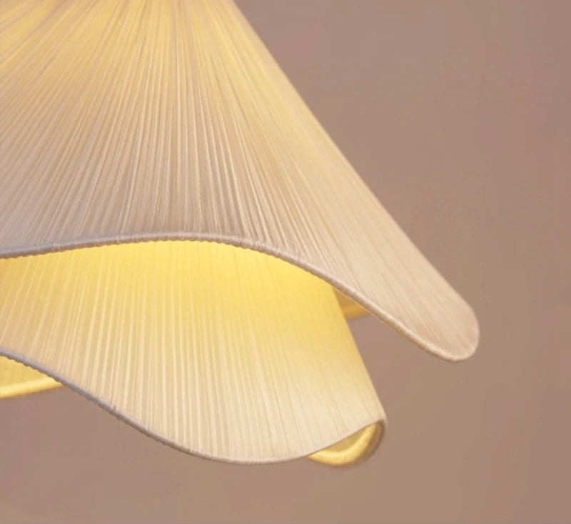 Close-up of a pleated lampshade with a soft focus background