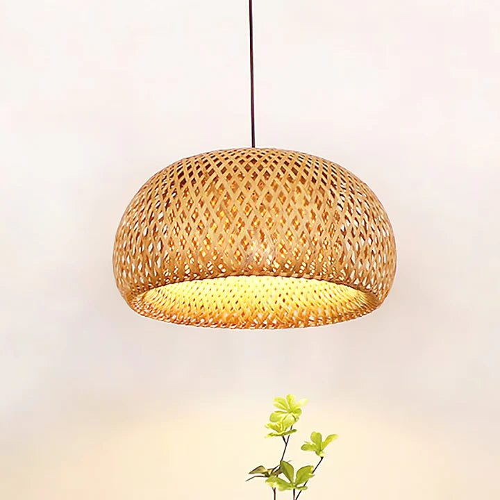 Woven bamboo pendant light with a soft glow on a neutral background