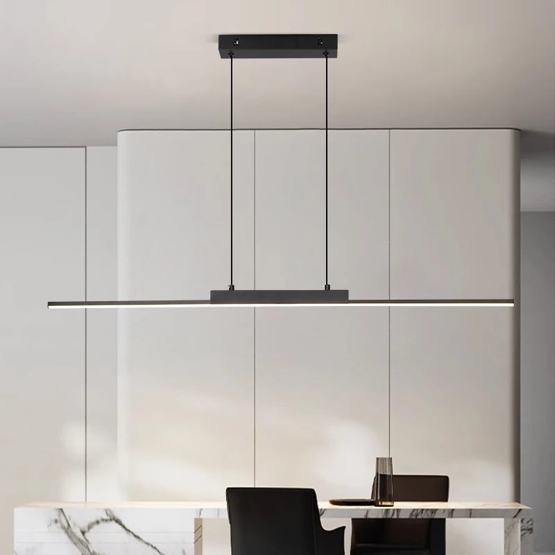Modern pendant light fixture in a minimalistic interior setting.