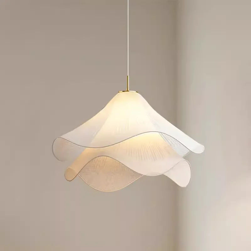 Modern pendant light with a white and gold design on a neutral background