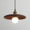 Wooden mahogany pendant light with a white bulb on a grey background
