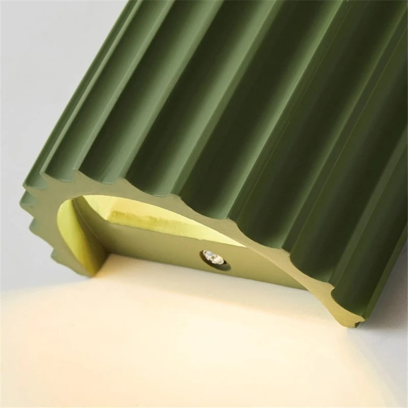 Green metal bracket on a white background