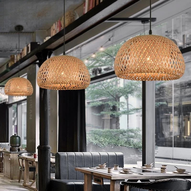 Woven pendant lights hanging above a dining area with large windows.