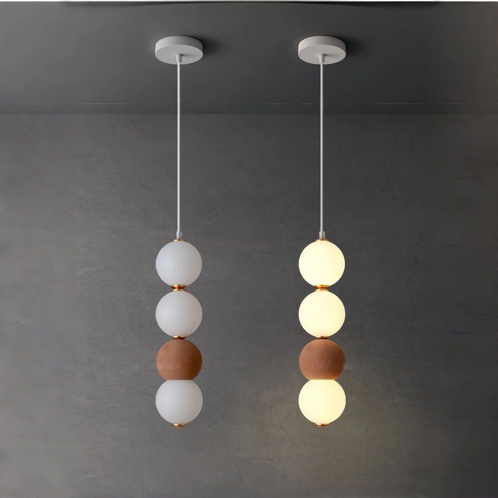 Two side by side pendant lights comparing what they look like with one light turned off and one light turned on
