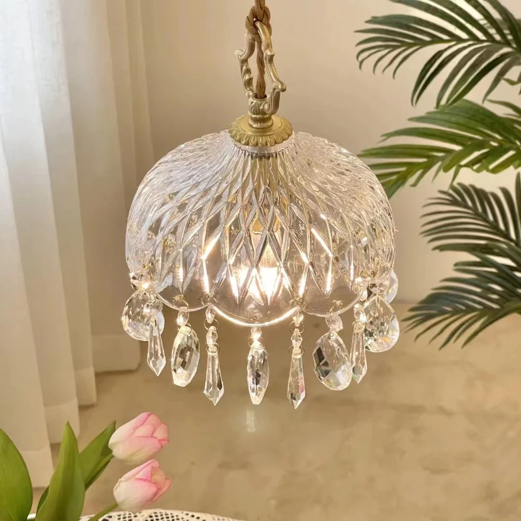 Crystal chandelier with decorative elements on a neutral background