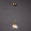 Transparent pendant light with gold fixture and clear glass shade on a dark background