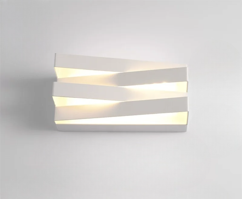 Modern wall light fixture on a plain background
