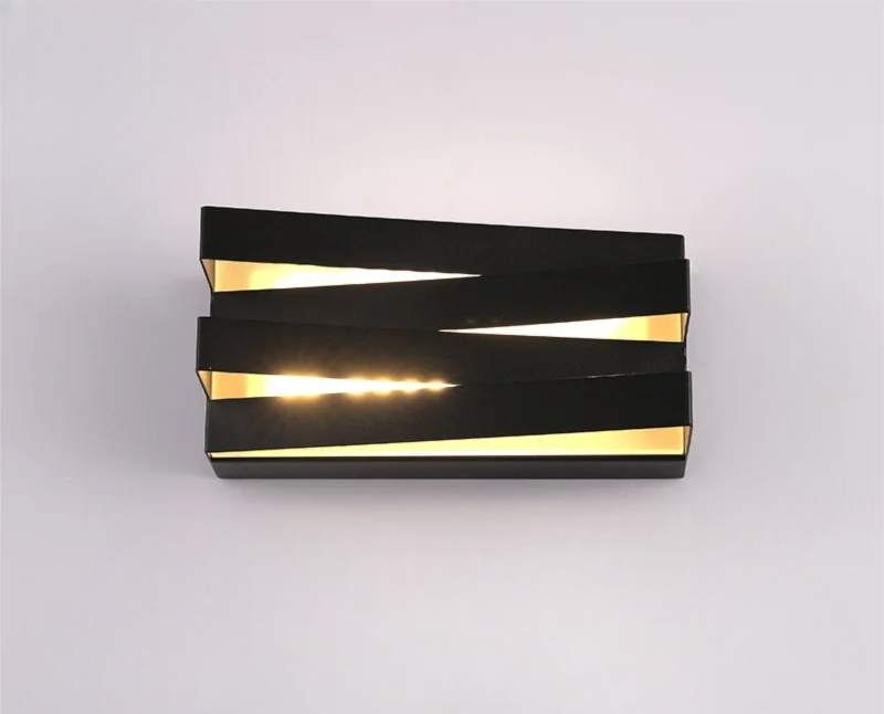 Black modern wall sconce on a plain white background