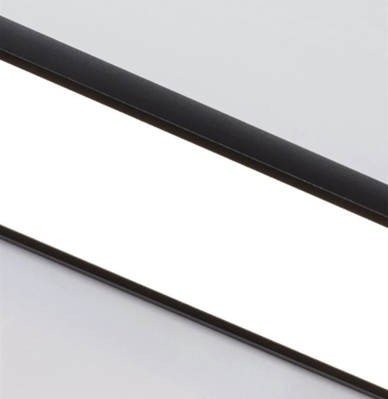Up close shot of the outdoor motion sensor light while illuminating a white background